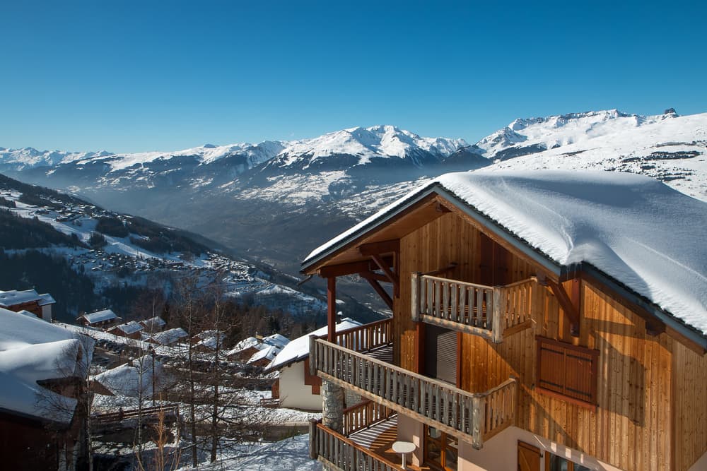 Mountain chalet representing the offer stage progressing