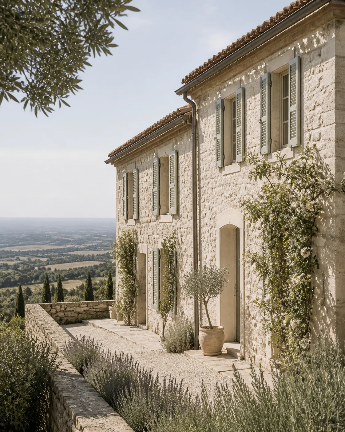 A stone European country home with shuttered windows