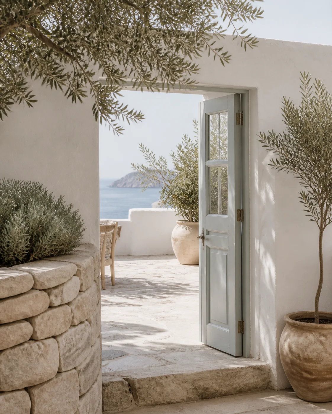 A white island home above the Aegean Sea