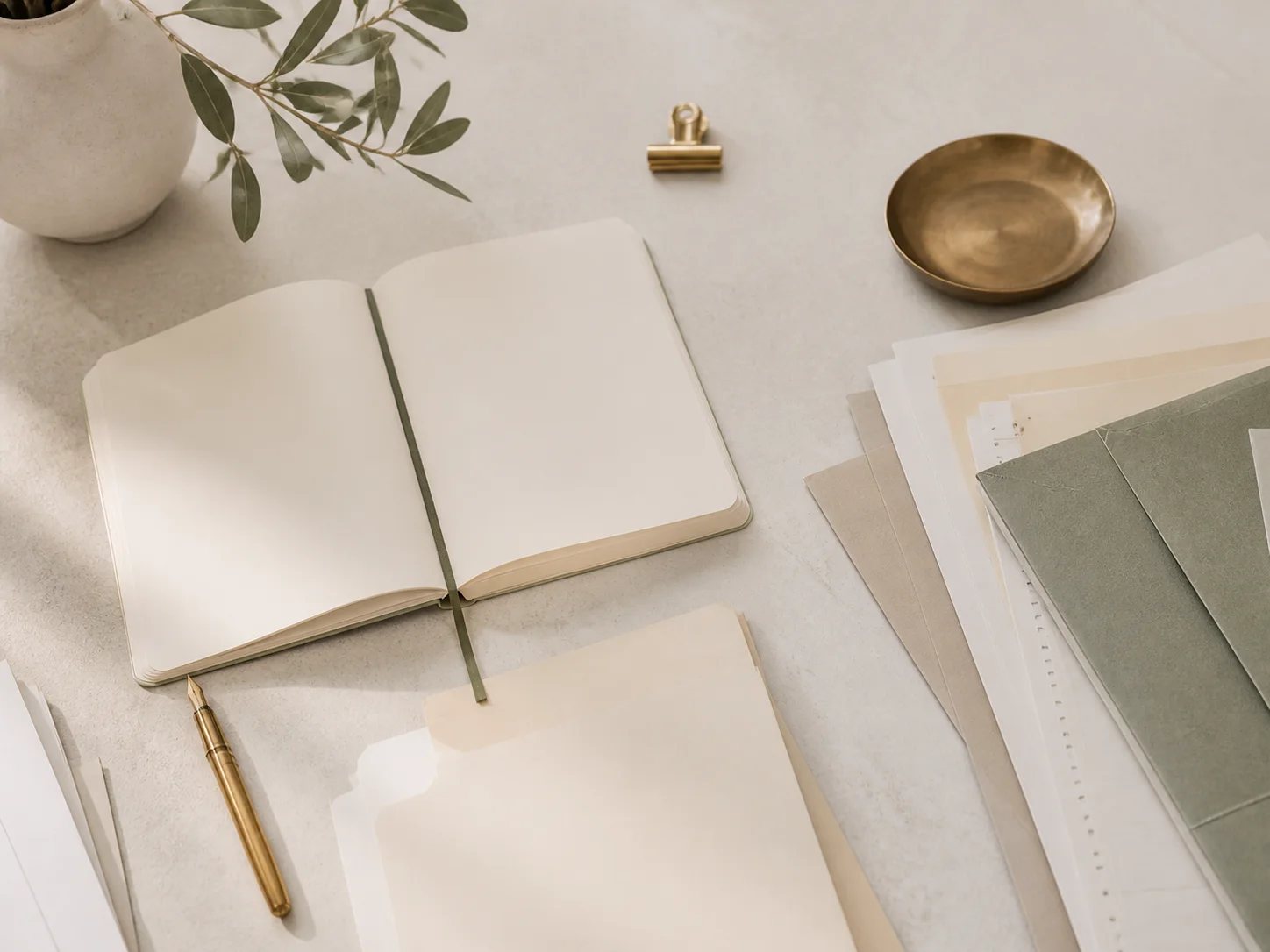 An orderly mortgage-planning desk with several document folders